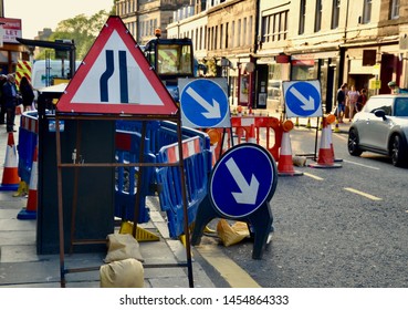 Roadworks and Road symbols for traffic on busy street in Edinburgh West end in the city centre. Tourists and local stores in background. Edinburgh city Scotland UK. jULY 2019