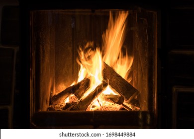 Roaring flames in a modern fireplace  - Powered by Shutterstock