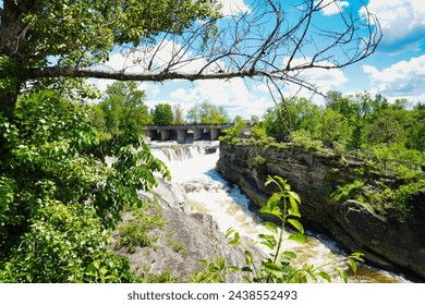 Roaring rapids of the Hogs back waterfall on the Rideau river at the Vincent Massey park in Ottawa,Ontario,Canada