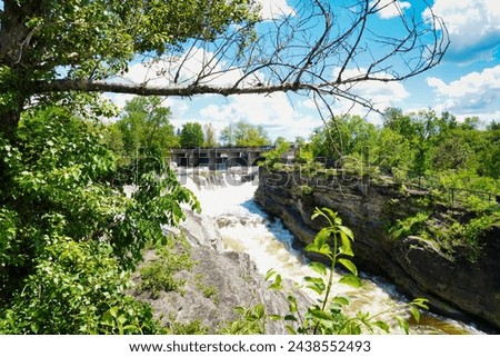 Roaring rapids of the Hogs back waterfall on the Rideau river at the Vincent Massey park in Ottawa,Ontario,Canada