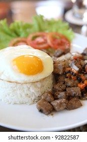 Roast Beef With Black Pepper And Fried Egg On Rice