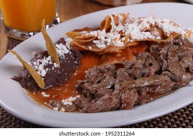 Roast beef with chilaquiles and refried black beans "arrachera con chilaquiles"
