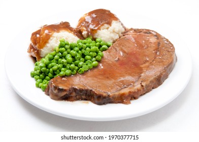 Roast Beef Dinner With Mashed Potatoes, Gravy And Fresh Vegetables