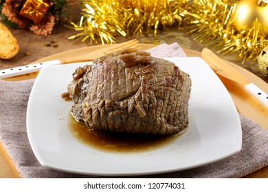 Roast Beef With Gravy On Christmas Background