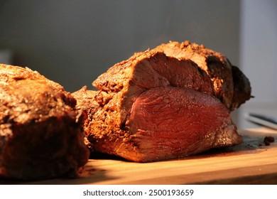 roast beef meat at the buffet under golden lights ready to slice carnivore diet for classy food carving protein for dinner