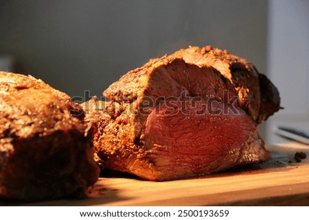roast beef meat at the buffet under golden lights ready to slice carnivore diet for classy food carving protein for dinner