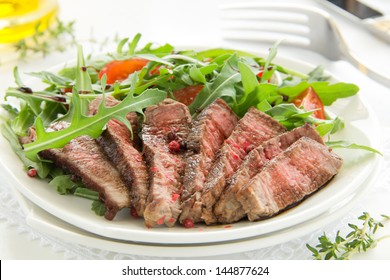 Roast Beef With Salad Of Arugula And Tomatoes.