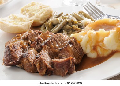 Roast Beef Smothered In Mushroom Gravy With Mashed Potatoes