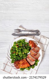 Roast Beef Tenderloin With Kale Salad On White Plate