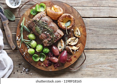 Roast Beef With Yorkshire Pudding, Brussels Sprouts, Porcini Mushrooms And Shallots. Traditional British Roast Beef. Overhead View