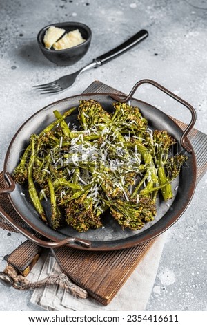 Roast Broccolini cabbage with crispy parmesan cheese. White background. Top view.