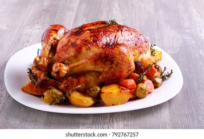 Roast chicken with brussel sprouts, carrot and potato - Shutterstock ID 792767257