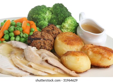 Roast Chicken Dinner With Stuffing And Individual Gravy Boat