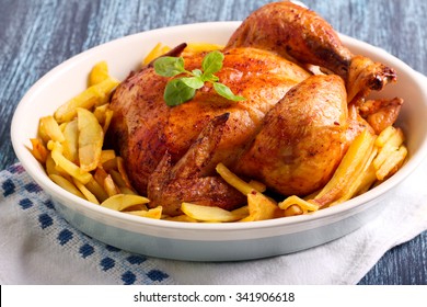 Roast Chicken And Potato Chips In A Tin