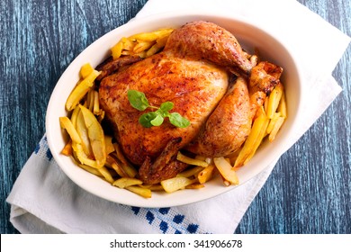 Roast Chicken And Potato Chips In A Tin