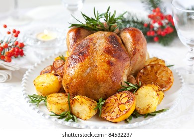 Roast Chicken With Potatoes,lemons And Rosemary For Christmas