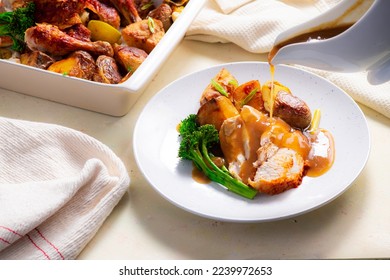 Roast Chicken served with Veg and Gravy being poured