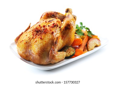 Roast Chicken And Various Vegetables On A White Plate Isolated On White