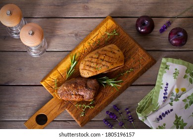 Roast Duck Breast Fillet On Serving Board. Overhead Horizontal Image