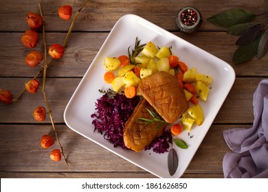 Roast Duck Breast Fillets With Potatoes, Carrots, Red Cabbage And Herbs. Overhead Horizontal Photo
