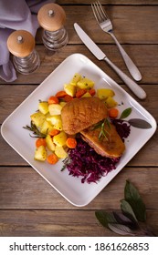 Roast Duck Breast Fillets With Potatoes, Carrots, Red Cabbage And Herbs. Overhead Vertical Photo
