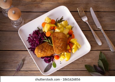 Roast Duck Breast Fillets With Potatoes, Carrots, Red Cabbage And Herbs. Overhead Horizontal Photo
