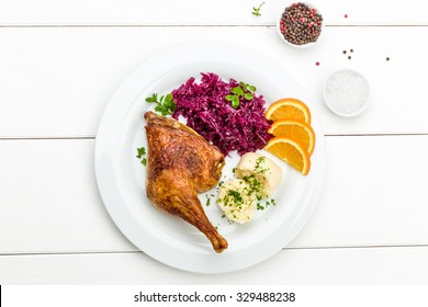 Roast Duck With Dumplings, Red Cabbage And Oranges