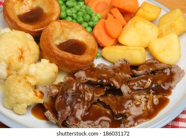 Roast lamb Sunday dinner with Yorkshire puddings.