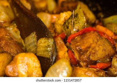 Roast meat, onions, carrots and spices, boiling in oil - Shutterstock ID 1151472857