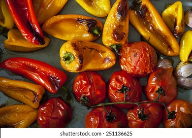 Roast peppers and tomatoes on baking tray - Powered by Shutterstock