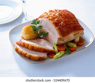 Roast Pork With Crackling And Vegetables On A Plate, Traditional German Food