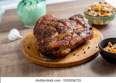 Roast Pork Meat But With A Bone On A Wooden Board