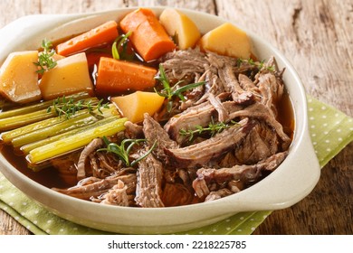 Roast Pot Of Slow Cooked Beef With Vegetables In A Spicy Sauce Close-up In A Frying Pan On The Table. Horizontal
