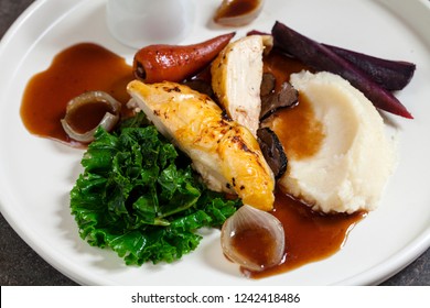 Roast Poussin With Celeriac Mash, Carrot, Kale, Truffle And Gravy