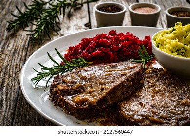 Roast Stuffed Beef With Potato Puree And Red Beets On Wooden Table 