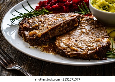 Roast Stuffed Beef With Potato Puree And Red Beets On Wooden Table 