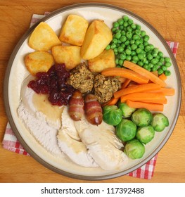 Roast turkey Christmas dinner with traditional trimmings.