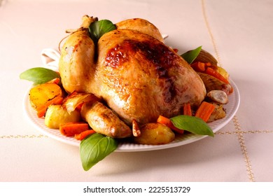 Roast whole chicken with vegetables - Shutterstock ID 2225513729