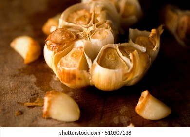 Roast whole garlic in rustic wood setting
