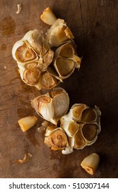 Roast whole garlic in rustic wood setting