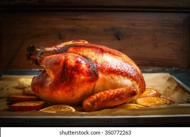 Roast Whole Turkey Or Chicken Over Wooden Background, Side View