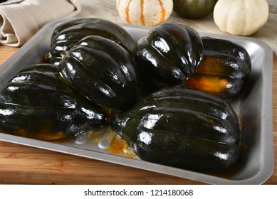 Roasted Acorn Squash Halves In A Baking Pan