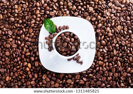 Roasted beans background, board frame with coffee grains, concept menu card, top view, copy space