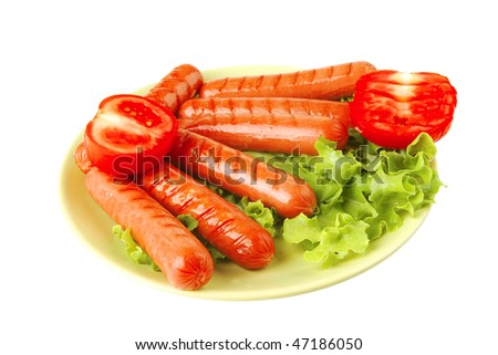 roasted beef sausages over white with salad and ketchup