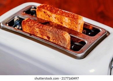 Roasted Bread Popping Up From Toaster Machine