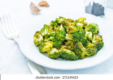 Roasted Broccoli With Garlic On A White Background. The Toning. Selective Focus