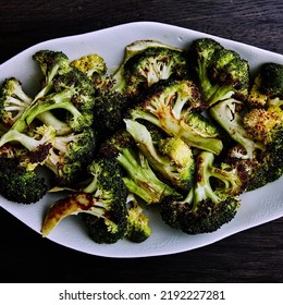 Roasted Broccoli Served On A White Plate
