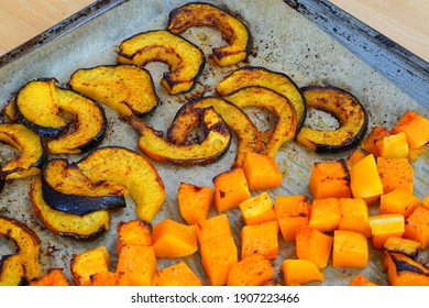 Roasted Butternut Squash Cubes And Acorn Squash Slices On Parchment Paper On A Baking Sheet