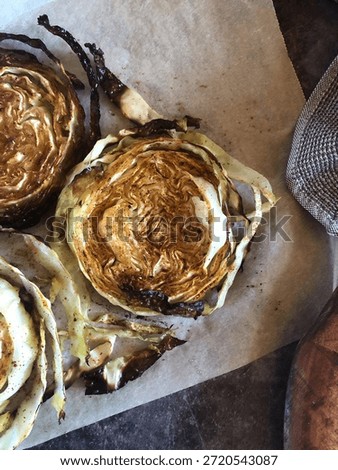 Roasted cabbage wedges baking sheet vegan side dish vegetarian oven roasted caramelized cabbage plant based parchment paper simple vegetables healthy roasting Noordwijk, Netherlands September 21, 2020