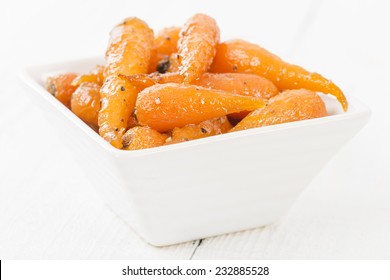 Roasted Carrots - Honey Roasted Baby Carrots On A White Background.